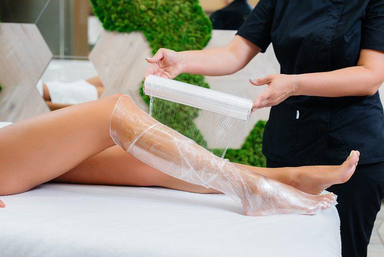 young beautiful girl is doing cosmetology procedure full body